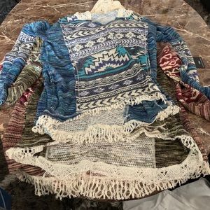 3 shirts with hoods on the back